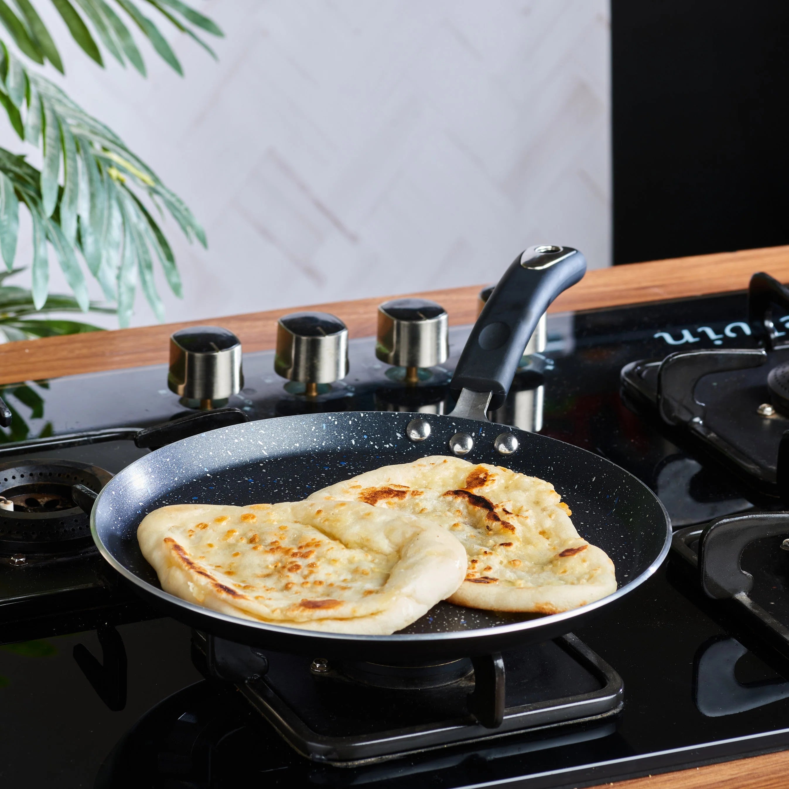 Vinod Zest Non-Stick Marbilo Dosa Tawa with a 5-layer non-stick coating, suitable for induction and gas stoves.