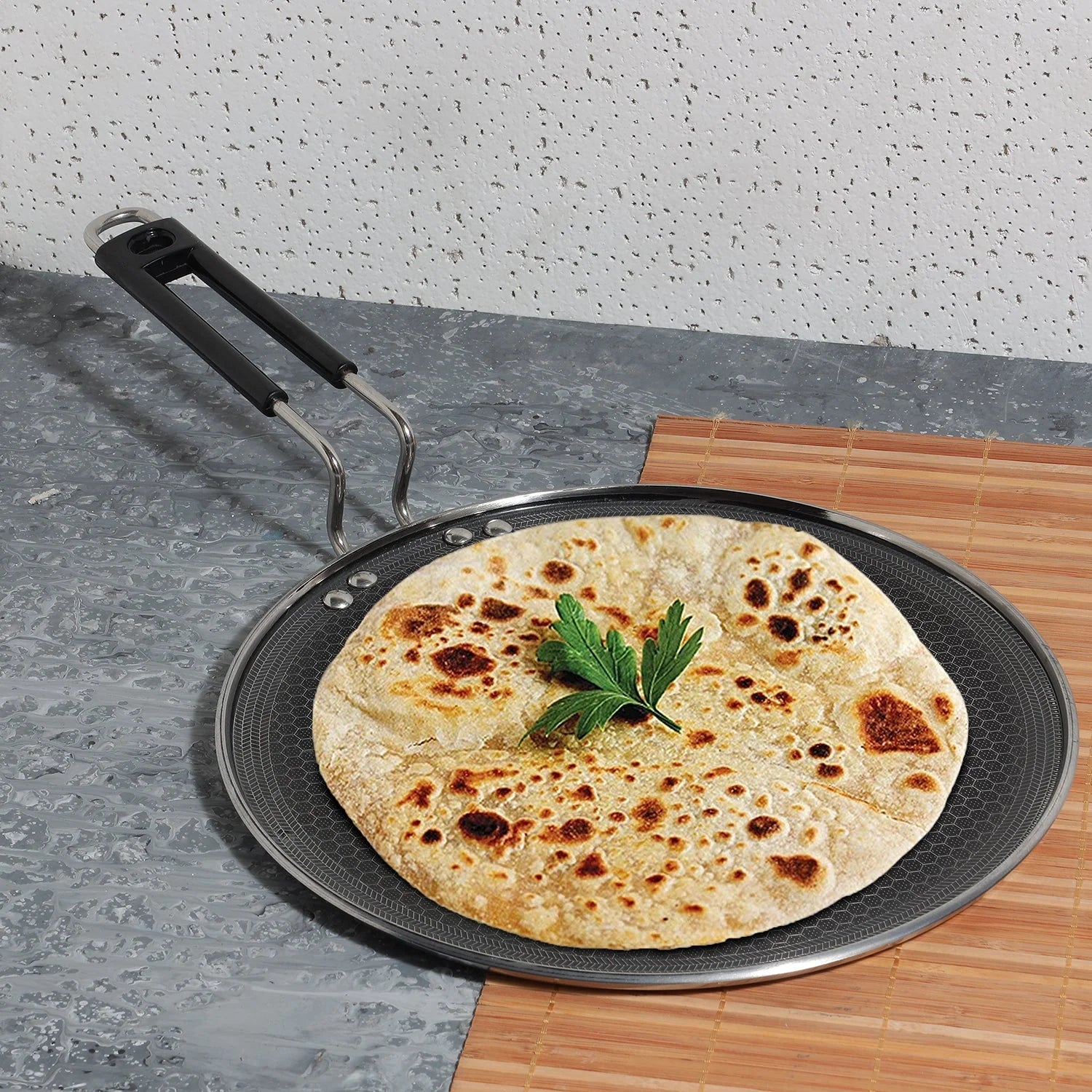 Healthy cooking demonstration using Vinod Platinum toxin-free non-stick coating on triply stainless steel tawa with perfectly cooked herb-garnished flatbread