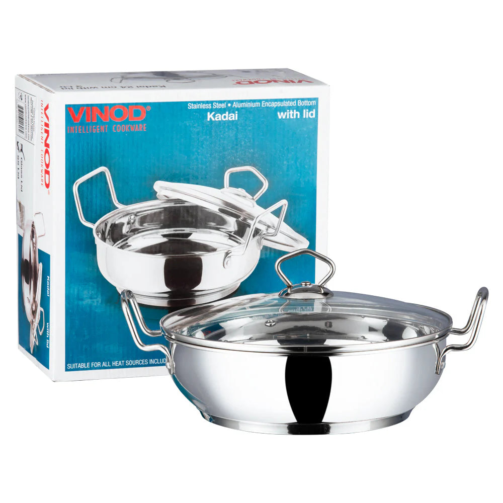 Vinod stainless steel kadai with toughened glass lid and original packaging box showing SAS bottom technology and aluminum encapsulated construction for induction compatibility